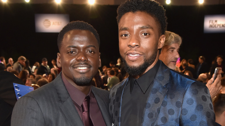 Daniel Kaluuya and Chadwick Boseman smiling 