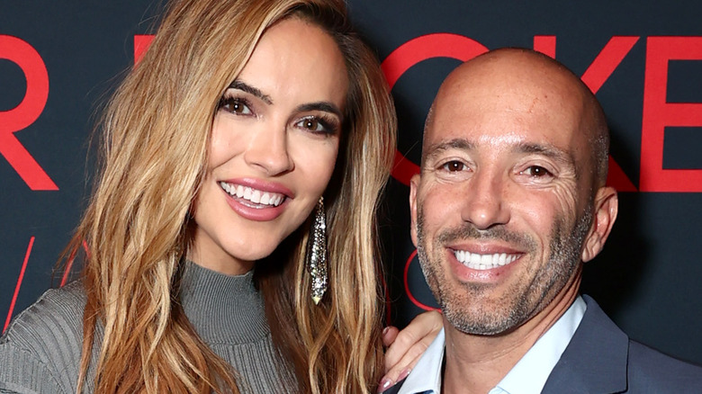 Chrishell Stause, Jason Oppenheim, posing together