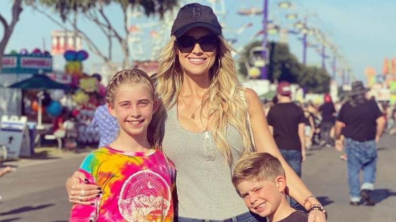 Christina Hall posing with her two older kids