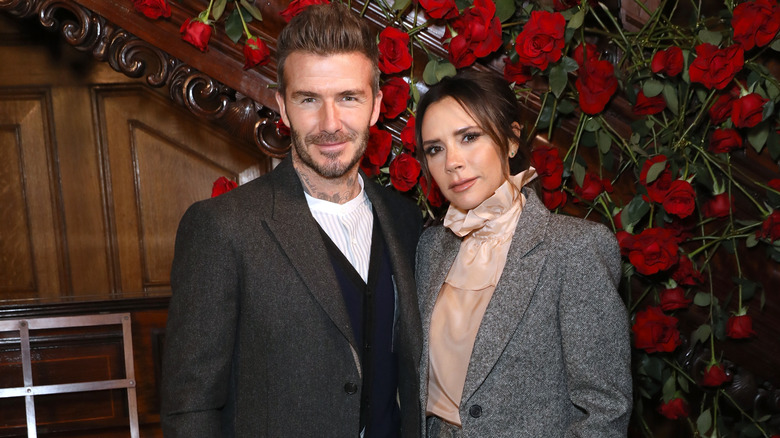 David and Victoria Beckham smiling 