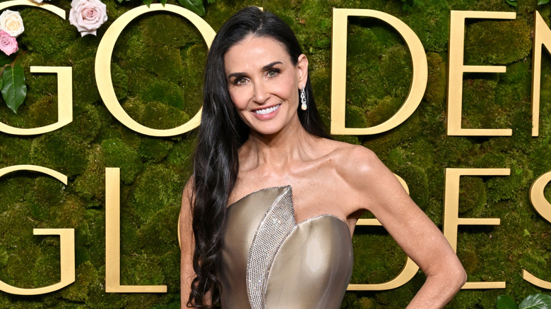 Demi Moore wearing gold dress at the Golden Globes