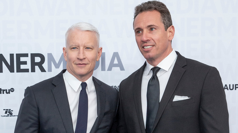 Anderson Cooper and Chris Cuomo posing on the red carpet