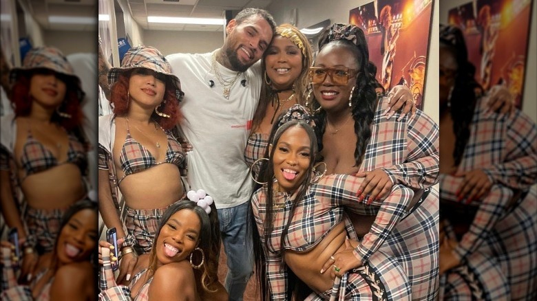 Lizzo and her friends posing with Chris Brown