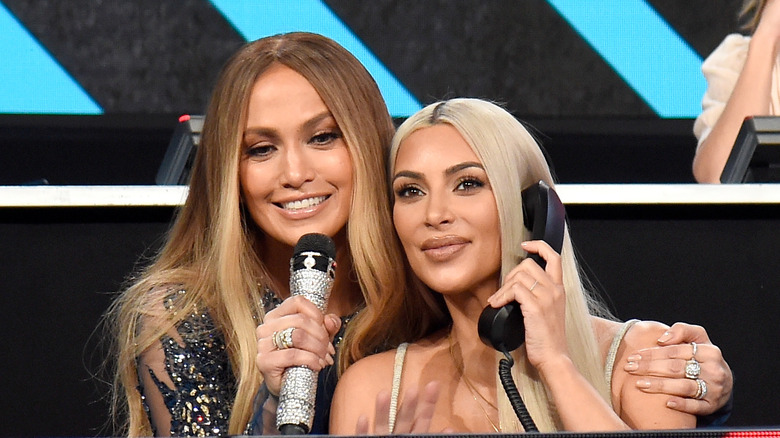 Jennifer Lopez arm around Kim Kardashian