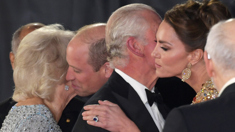 Prince William and Kate Middleton kissing Camilla Parker Bowles and Prince Charles on the cheek