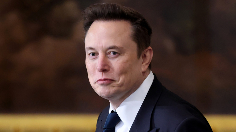 Elon Musk in a suit