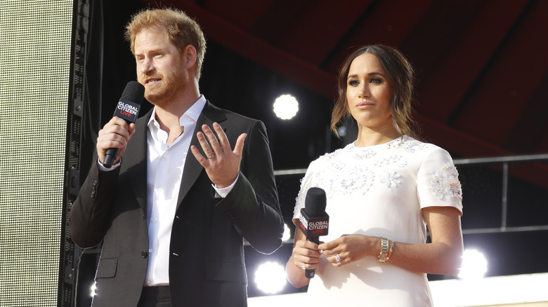 Prince Harry and Meghan Markle speaking to a crowd