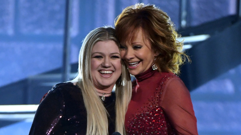 Kelly Clarkson and Reba McEntire performing during the 53rd Academy of Country Music Awards