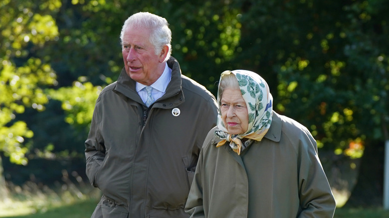 Queen Elizabeth II walking with Prince Charles