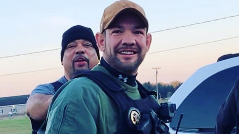 Leland chapman and friend in cop vest