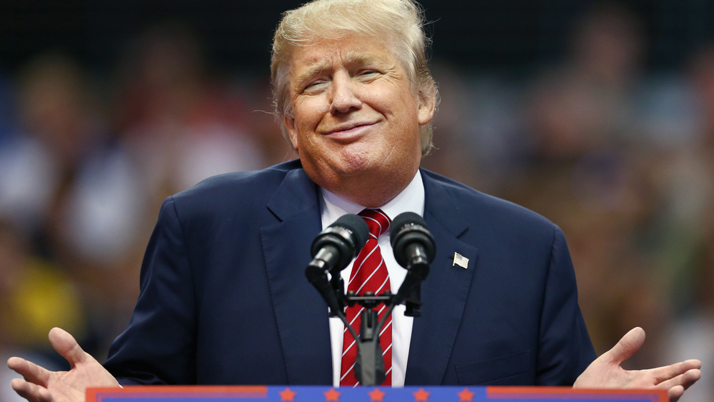Donald Trump shrugging and smirking