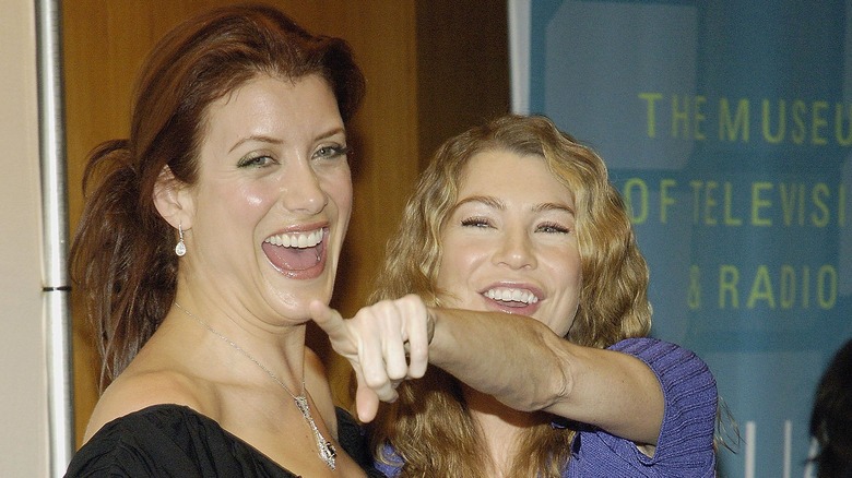 Kate Walsh and Ellen Pompeo smiling and pointing