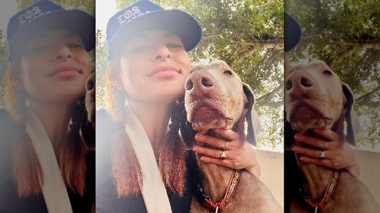 Eva Mendes posing with her dog