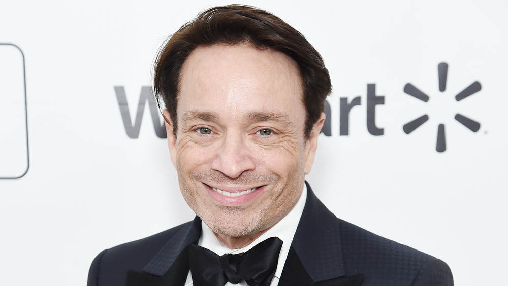 Chris Kattan smiling in tuxedo