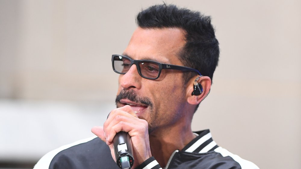 Danny Wood speaking into microphone