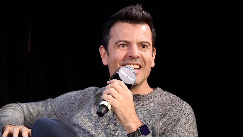 Jordan Knight speaking into microphone