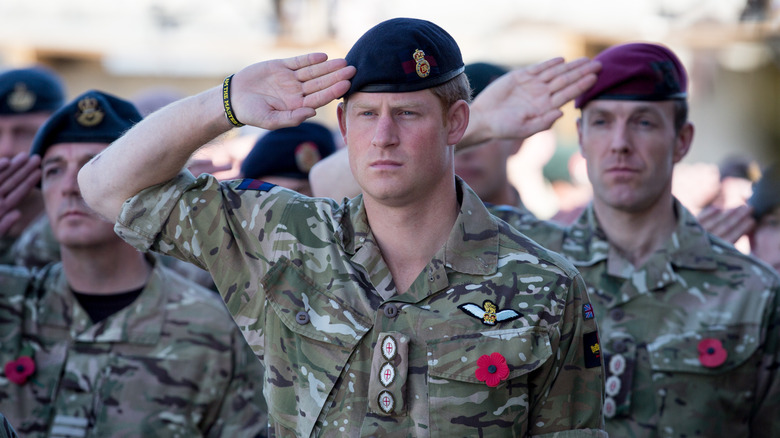 Prince Harry salutes in army uniform