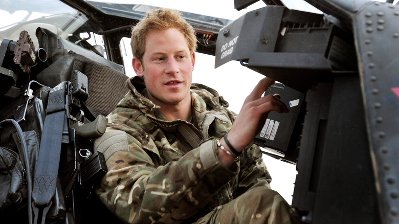 Prince Harry sitting in helicopter