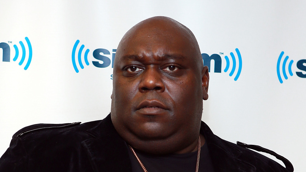 Faizon Love poses at an event