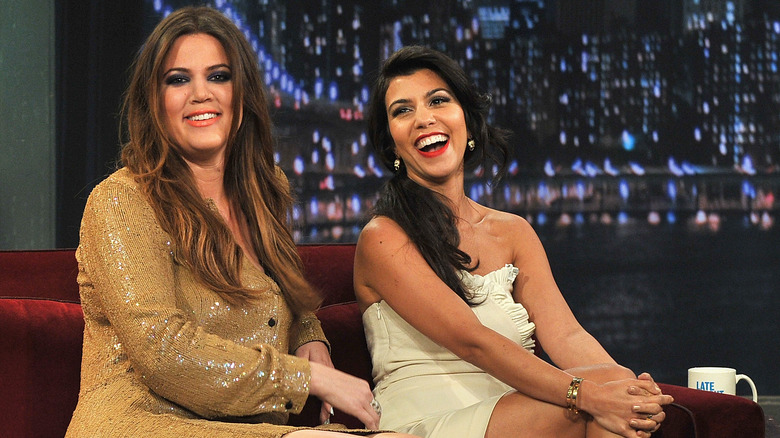 Khloe Kardashian smiling, Kourtney Kardashian laughing