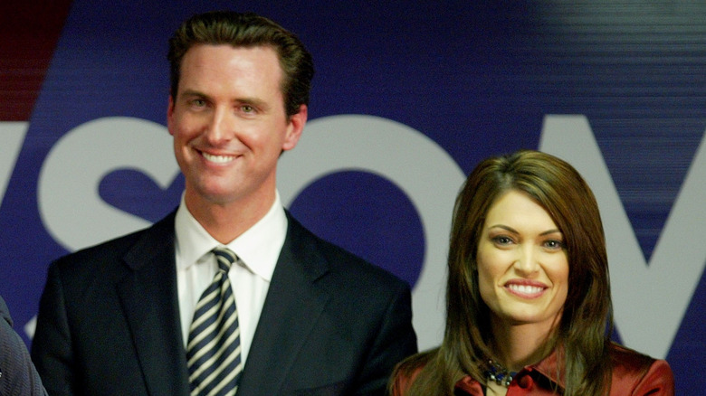 Gavin Newsom and Kimberly Guilfoyle smiling