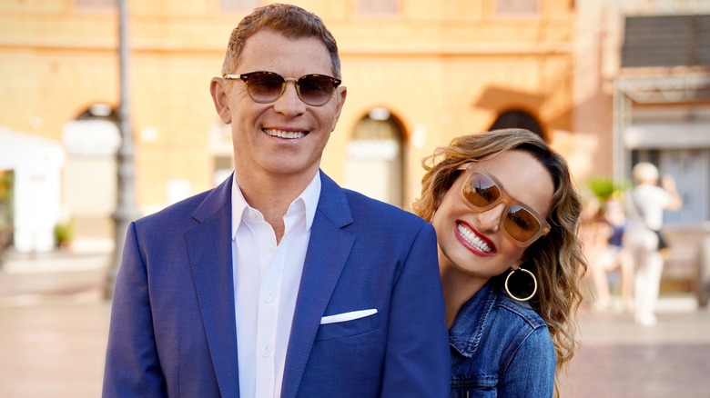 Bobby Flay and Giada De Laurentiis playfully smiling