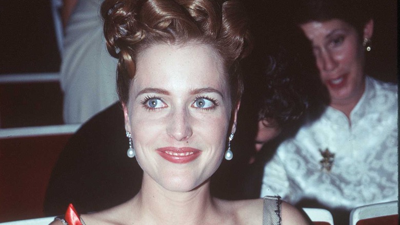 Gillian Anderson poses in intricate updo 