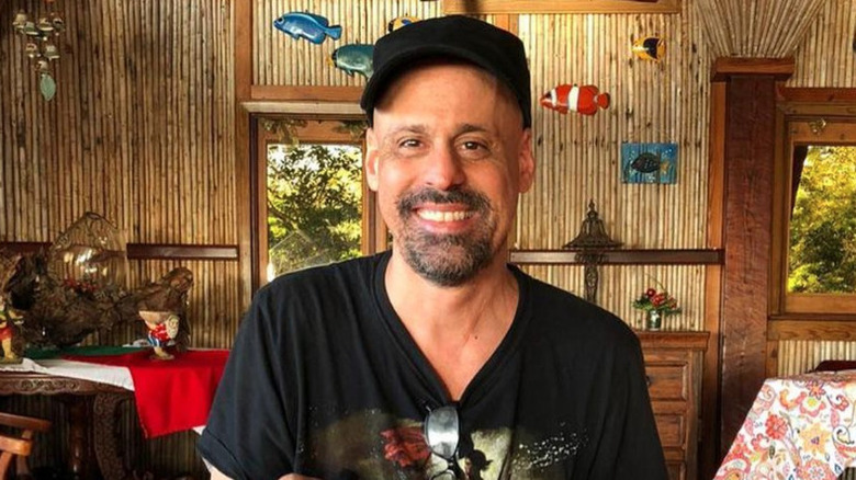 Gino Palazzolo smiles in a restaurant