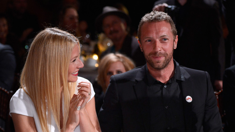 Gwyneth Paltrow laughing with Chris Martin