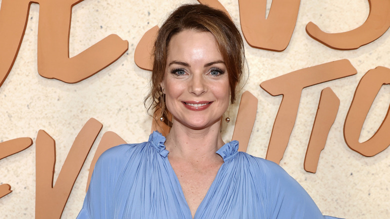 Kimberly Williams-Paisley posing in a blue top