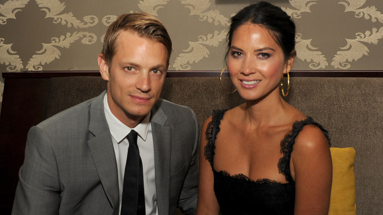 Joel Kinnaman Olivia Munn posing