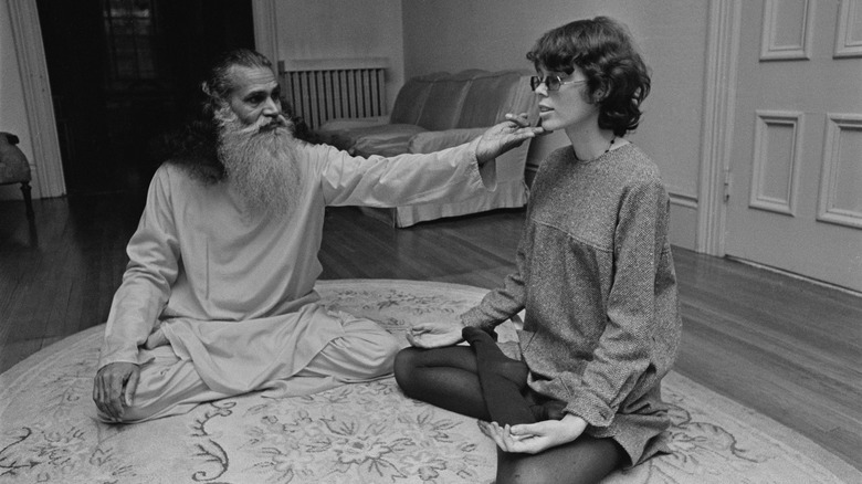 Prudence Farrow meditating with a guru