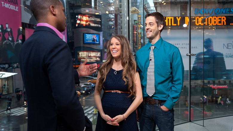 Jill Duggar and husband Derick Dillard doing TV interview in Times Square