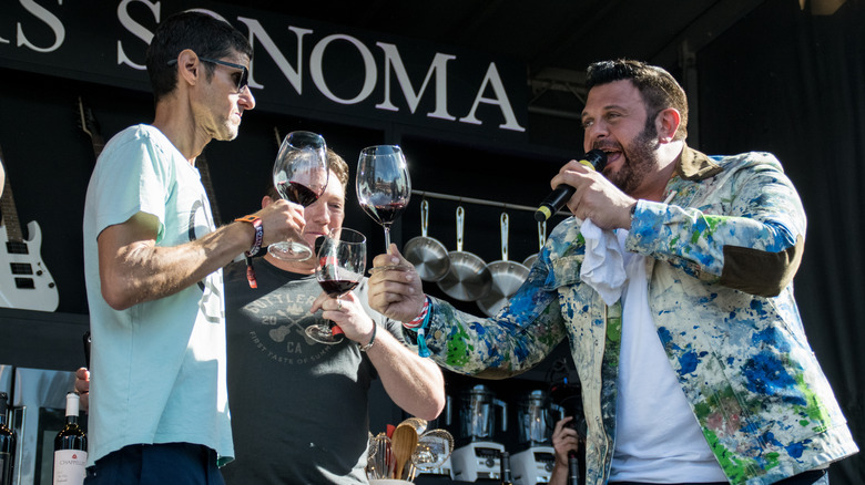 Adam Richman drinking wine with the Beastie Boys