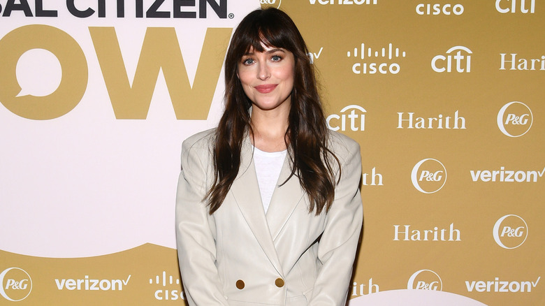 Dakota Johnson poses on the red carpet