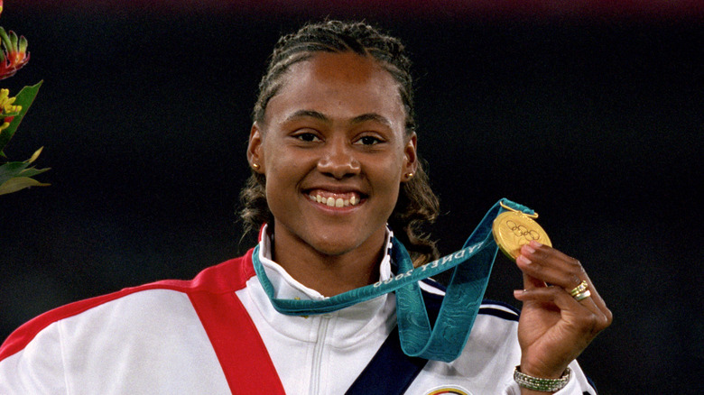 MArion Jones hold a medal