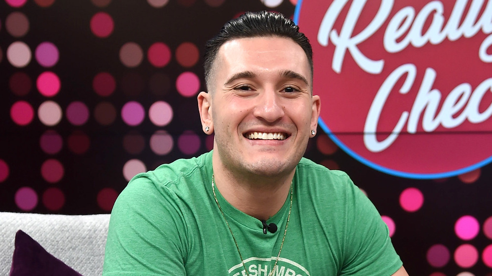 Joey Sasso smiling during an interivew