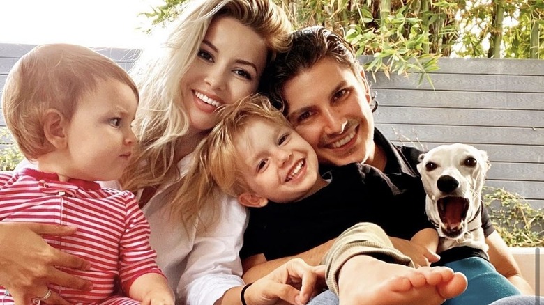 Masiela Lusha, with her children and husband, smiling