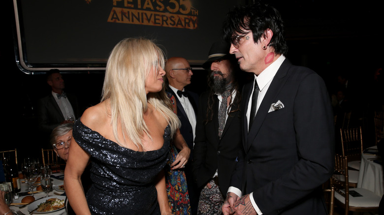 Pamela Anderson and Tommy Lee talking