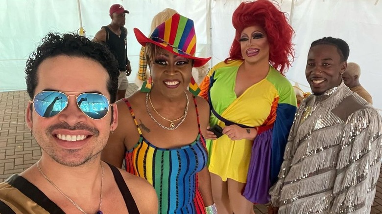 Javier Rivera with drag queens at the 2022 Pride Parade