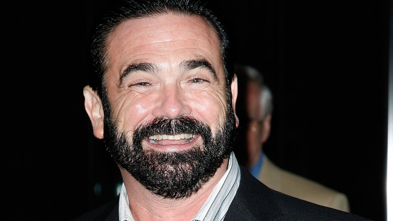 Billy Mays smiling in grey suit