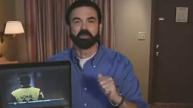 Billy Mays holding a laptop