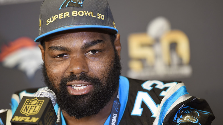 Michael Oher wearing a hat