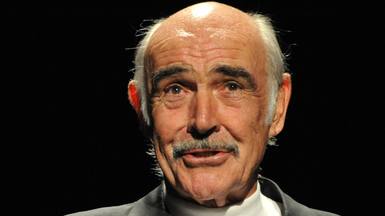 Sean Connery speaking at an event 