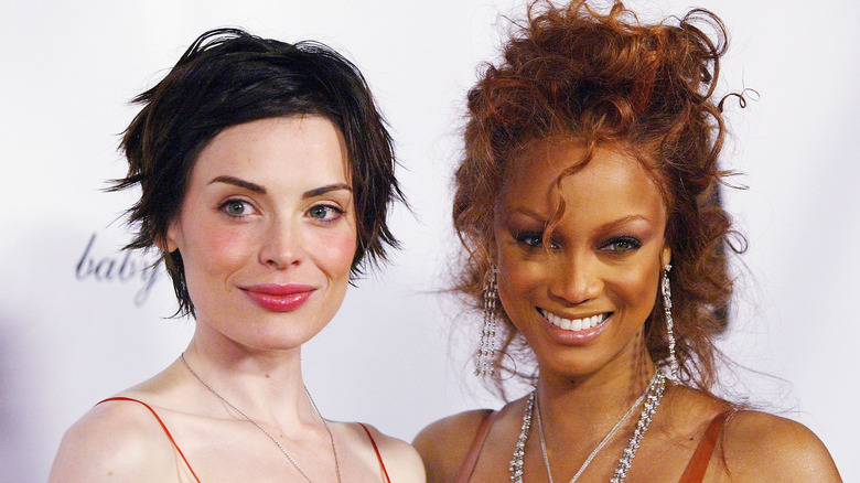 Yoanna House and Tyra Banks on the red carpet