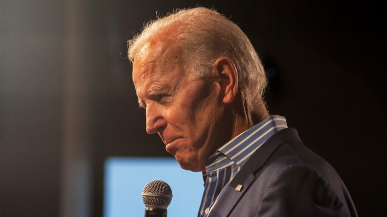 Joe Biden poses with a microphone.