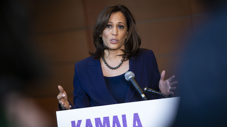 Kamala Harris speaking at a podium