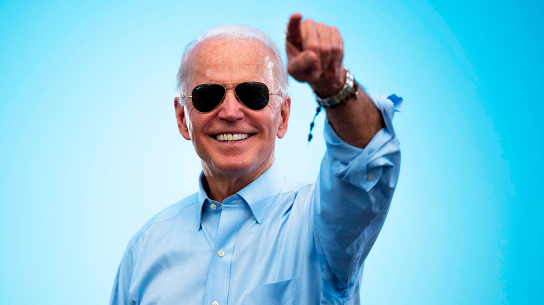 Joe Biden smiling and pointing 