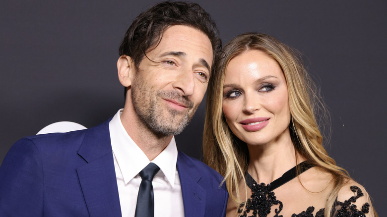 Georgina Chapman posing with Adrien Brody