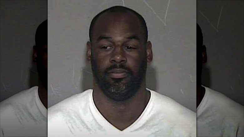 Donovan McNabb posing for his DUI mugshot